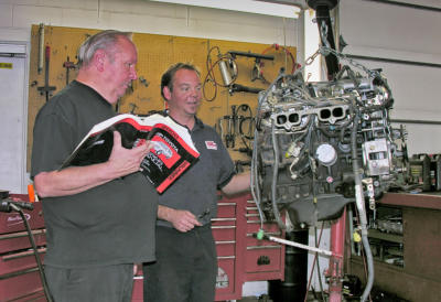 Dave and Matt discussing an engine rebuild