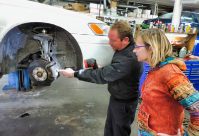 Matt discussing a car brake repair with a customer